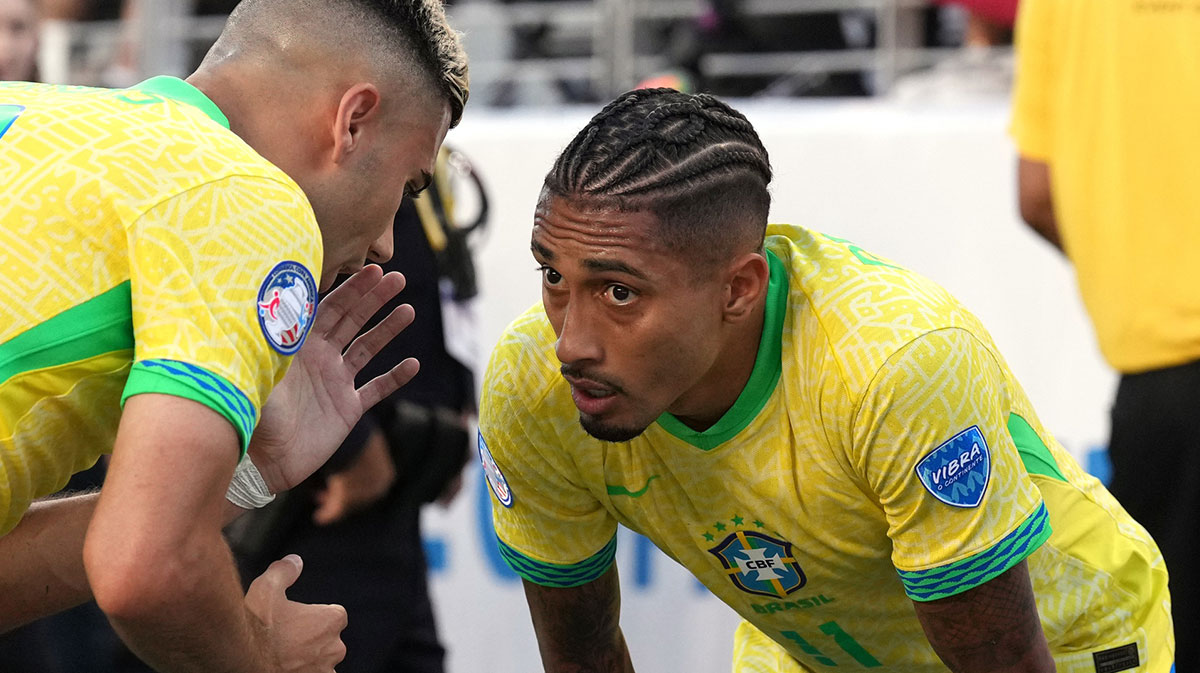 Brazil midfielder Andreas Pereira (left) talks with midfielder Raphinha (right) during the second half against Colombia at Levi's Stadium.