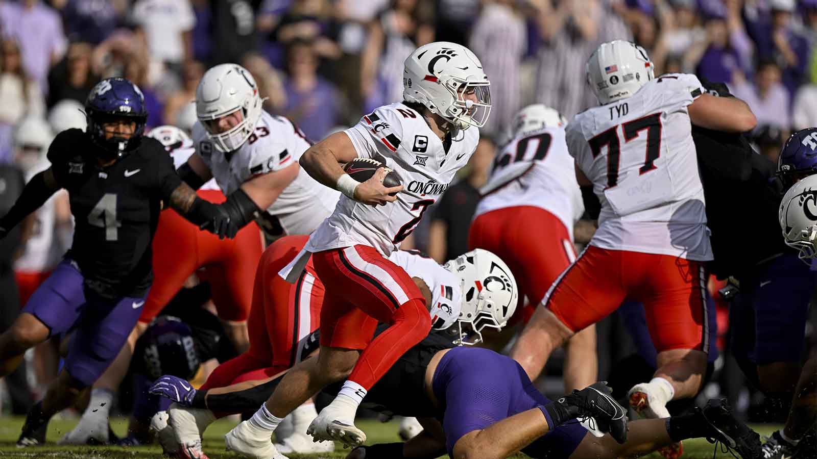 Cincinnati Bearcats quarterback Brendan Sorsby (2) runs with the ball during the game between the Horned Frogs and the Bearcats at Amon G. Carter Stadium.