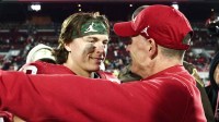 Oklahoma Sooners head coach Brent Venables hugs Oklahoma Sooners quarterback John Mateer (10) after the game against the Louisiana State Tigers at Gaylord Family-Oklahoma Memorial Stadium. Mandatory Credit: Kevin Jairaj-Imagn Images