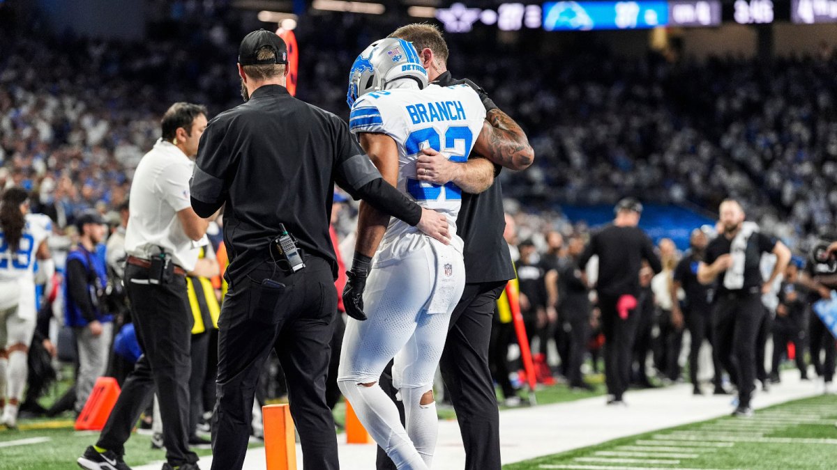 Detroit Lions safety Brian Branch (32) with help of Lions staff, walk off the field due to an injury during the second half against Dallas Cowboys at Ford Field in Detroit on Thursday, Dec. 4, 2025.