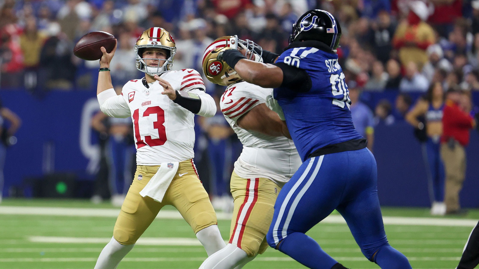 San Francisco 49ers quarterback Brock Purdy (13) passes the ball against the Indianapolis Colts in the first quarter of the game at Lucas Oil Stadium.