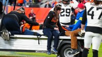 Denver Broncos wide receiver Pat Bryant (13) is taken off the field after an injury during the second at Empower Field at Mile High.