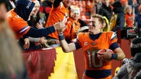 Denver Broncos quarterback Bo Nix (10) celebrates with fans after the game against the Washington Commanders at Northwest Stadium.