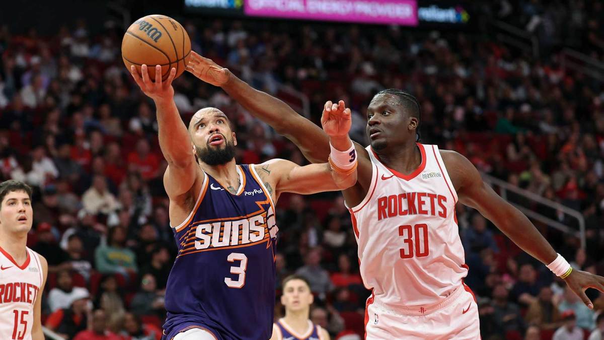 Houston Rockets center Clint Capela (30) defends as Phoenix Suns forward Dillon Brooks (3) attempts to shoot the ball during the third quarter at Toyota Center.