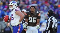 Cleveland Browns defensive end Myles Garrett (95) reacts after losing his helmet on a play during the second half of an NFL football game at Huntington Bank Field, Dec. 21, 2025, in Cleveland, Ohio.