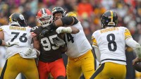 Cleveland Browns defensive end Myles Garrett (95) tries to get past Pittsburgh Steelers offensive tackle Troy Fautanu (76) and guard Spencer Anderson (74) during the second half of an NFL football game at Huntington Bank Field, Dec. 28, 2025, in Cleveland, Ohio.