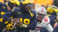 Ohio State Buckeyes defensive end Kenyatta Jackson Jr. (97) sacks Michigan Wolverines quarterback Bryce Underwood (19) during the NCAA football game at Michigan Stadium in Ann Arbor, Mich. on Nov. 29, 2025. Ohio State won 27-9.