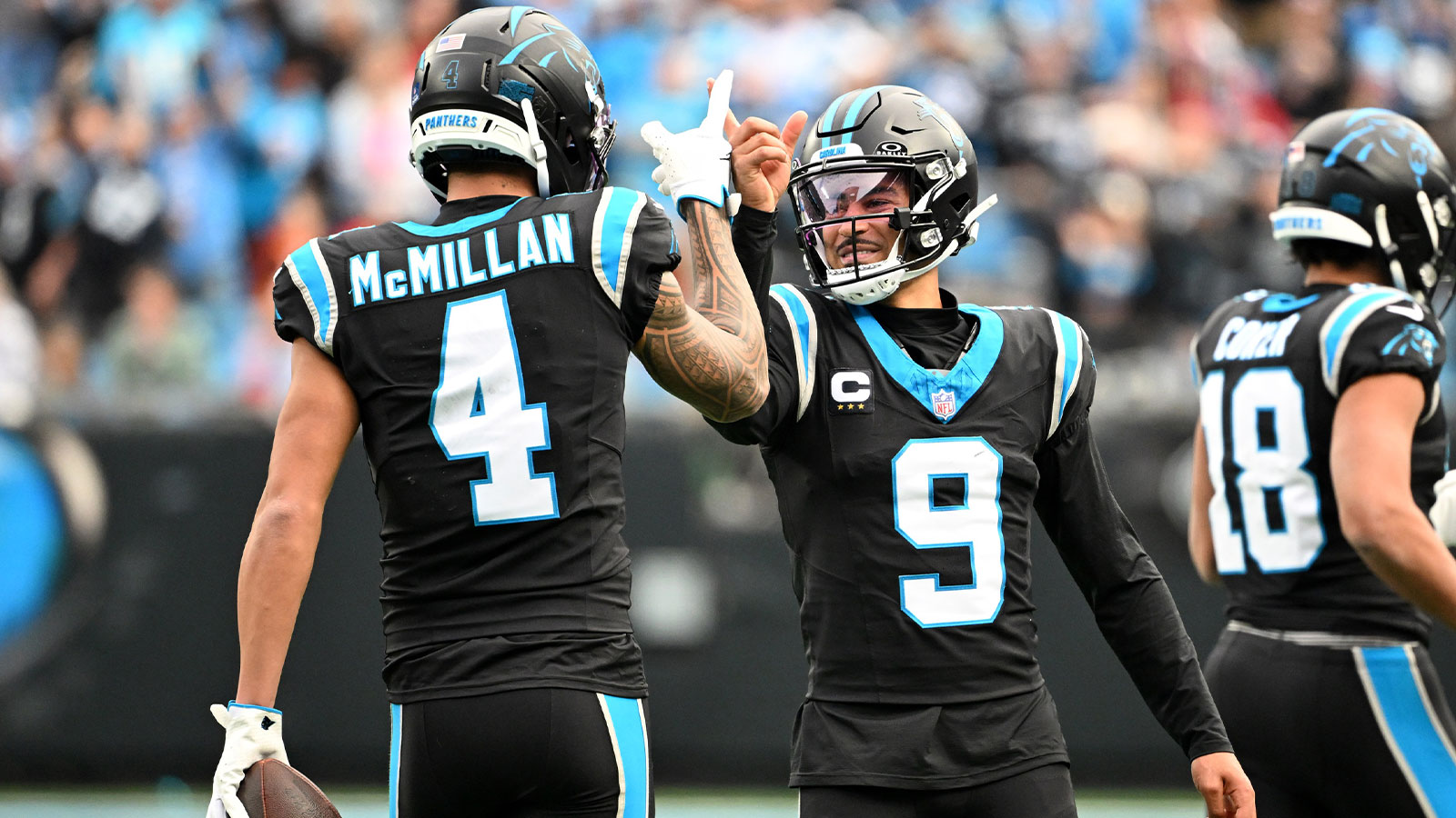 Carolina Panthers quarterback Bryce Young (9) celebrates with wide receiver Tetairoa McMillan (4) after a play during the first half against the Tampa Bay Buccaneers at Bank of America Stadium.