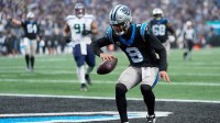 Carolina Panthers quarterback Bryce Young (9) reacts after scoring a ten-yard rushing touchdown against the Seattle Seahawks during the third quarter at Bank of America Stadium.