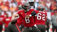 Tampa Bay Buccaneers quarterback Baker Mayfield (6) drops back to pass against the Carolina Panthers in the first quarter at Raymond James Stadium.