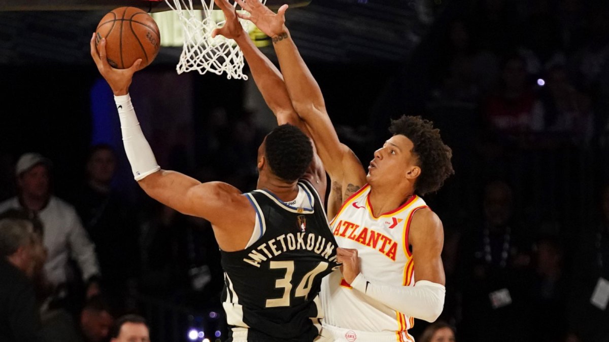 Bucks forward Giannis Antetokounmpo (34) shoots against Atlanta Hawks forward Jalen Johnson (1) during the first half in a semifinal of the 2024 Emirates NBA Cup at T-Mobile Arena
