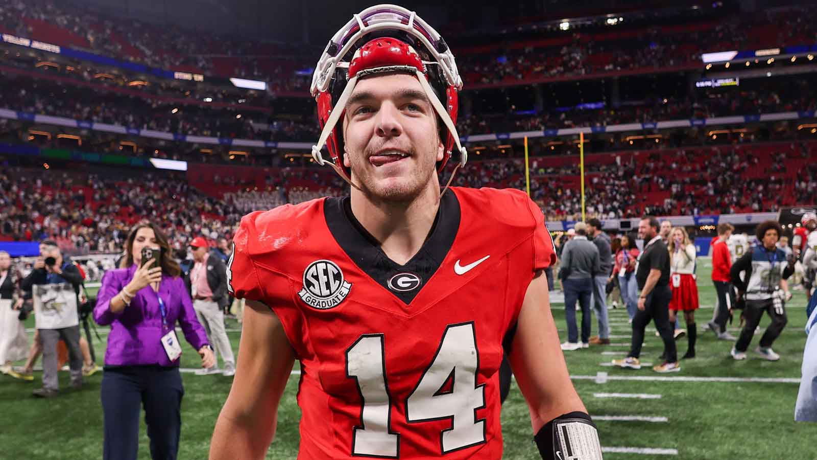 Georgia Bulldogs quarterback Gunner Stockton (14) celebrates after a victory over the Georgia Tech Yellow Jackets at Mercedes-Benz Stadium.