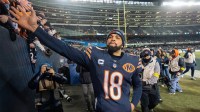 Chicago Bears quarterback Caleb Williams (18) high fives fans after their game Saturday, December 20, 2025 at Soldier Field in Chicago, Illinois. The Chicago Bears beat the Green Bay Packers 22-16 in overtime.