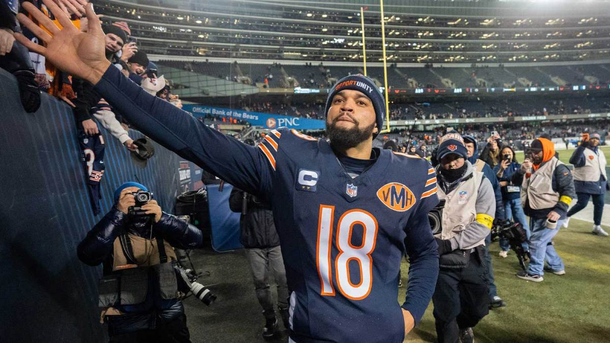 Chicago Bears quarterback Caleb Williams (18) high fives fans after their game Saturday, December 20, 2025 at Soldier Field in Chicago, Illinois. The Chicago Bears beat the Green Bay Packers 22-16 in overtime.
