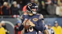 Chicago Bears quarterback Caleb Williams (18) looks to throw a pass against the Green Bay Packers during the first quarter at Soldier Field.