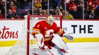 Calgary Flames goaltender Devin Cooley (1) guards his net against the Vegas Golden Knights during the third period at Scotiabank Saddledome.