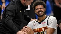 A Denver Nuggets trainer checks on forward Cameron Johnson (23) during the second half against the Dallas Mavericks at the American Airlines Center.