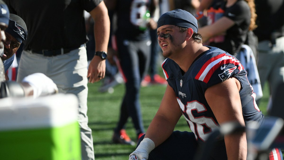 New England Patriots offensive tackle Will Campbell (66) talks to a teammate during the second half against the Carolina Panthers at Gillette Stadium.