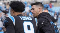 Carolina Panthers head coach Dave Canales greets quarterback Bryce Young (9) after a win against the Tampa Bay Buccaneers at Bank of America Stadium.