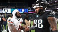 Chicago Bears running back D'Andre Swift (4) speaks with Philadelphia Eagles defensive tackle Jalen Carter (98) after the game at Lincoln Financial Field.