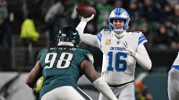 Detroit Lions quarterback Jared Goff (16) throws a pass under pressure form Philadelphia Eagles defensive tackle Jalen Carter (98) during the second half at Lincoln Financial Field.