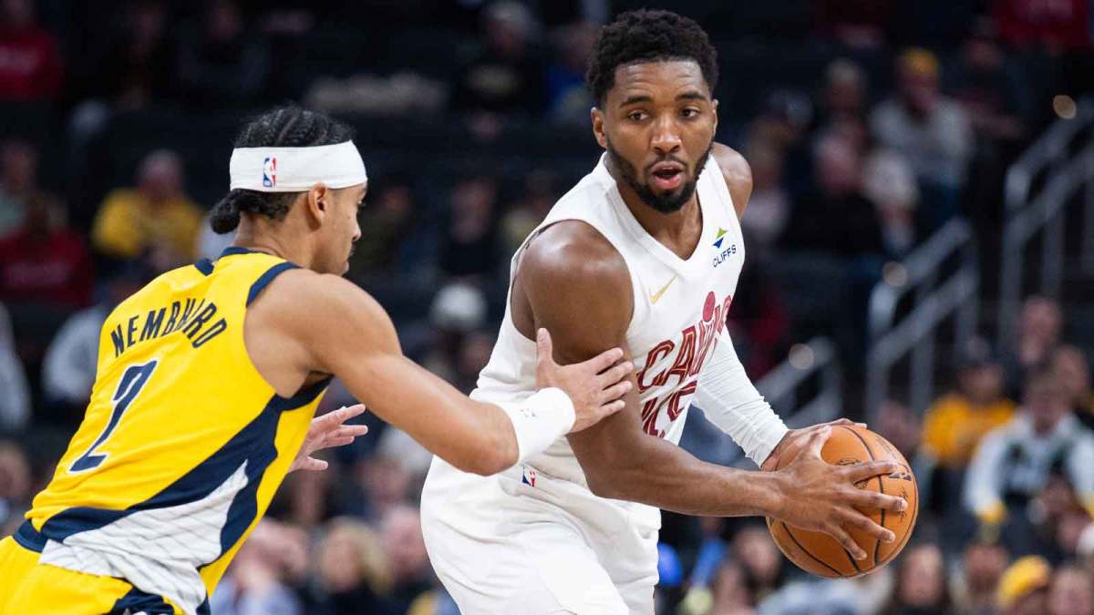 Cavs guard Donovan Mitchell (45) holds the ball