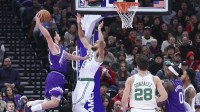 Jazz guard Walter Clayton Jr. (13) dunks against Boston Celtics guard Derrick White (9) during the first half at Delta Center