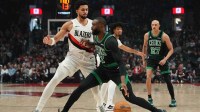 Boston Celtics guard Jaylen Brown (7) handles the ball against Portland Trail Blazers forward Toumani Camara (33) during the first half at Moda Center.