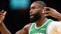 Celtics guard Jaylen Brown (7) reacts