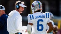 Ole Miss head coach Lane Kiffin talks with quarterback Trinidad Chambliss (6) during a college football game between Mississippi State and Ole Miss at Davis Wade Stadium in Starkville, Miss., on Friday, Nov. 28, 2025. Ole Miss defeated Mississippi State 38-19 in the Egg Bowl.