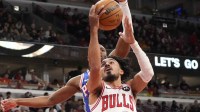 Dec 26, 2025; Chicago, Illinois, USA; Chicago Bulls guard Tre Jones (30) scores against the Philadelphia 76ers during the first half at United Center. Mandatory Credit: David Banks-Imagn Images