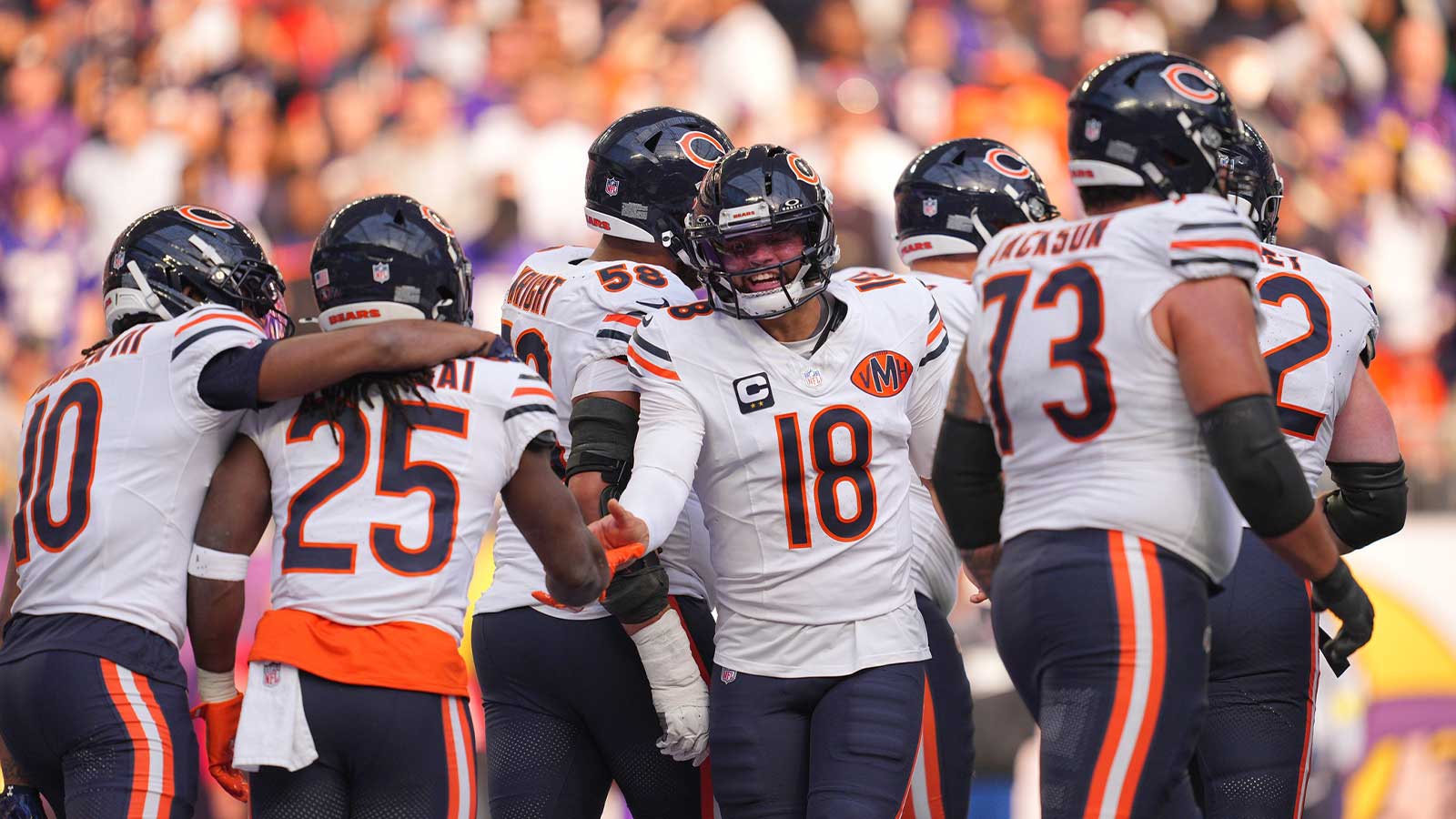 Chicago Bears running back Kyle Monangai (25) and quarterback Caleb Williams (18) celebrate a touchdown during the second quarter against the Minnesota Vikings at U.S. Bank Stadium.