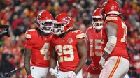 Kansas City Chiefs wide receiver Rashee Rice (4) and Kansas City Chiefs running back Kareem Hunt (29) celebrate after a touchdown during the third quarter against the Houston Texans at GEHA Field at Arrowhead Stadium.