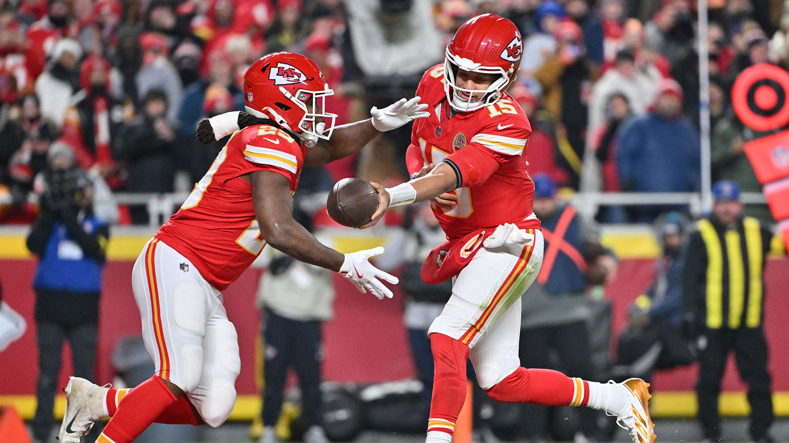 Kansas City Chiefs quarterback Patrick Mahomes (15) hands the ball off to Kansas City Chiefs running back Kareem Hunt (29) during the second quarter against the Houston Texans at GEHA Field at Arrowhead Stadium.