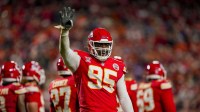 Kansas City Chiefs defensive tackle Chris Jones (95) gestures to teh crowd during the third quarter at GEHA Field at Arrowhead Stadium.