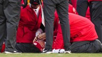 Kansas City Chiefs quarterback Patrick Mahomes (15) is attended to by team medical staff following an injury during the fourth quarter against the Los Angeles Chargers at GEHA Field at Arrowhead Stadium. Mandatory Credit: Jay Biggerstaff-Imagn Images