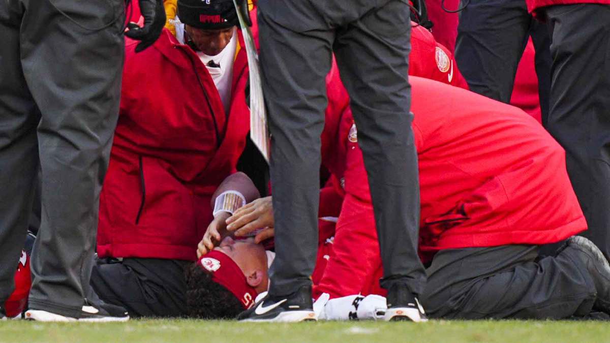 Kansas City Chiefs quarterback Patrick Mahomes (15) is attended to by team medical staff following an injury during the fourth quarter against the Los Angeles Chargers at GEHA Field at Arrowhead Stadium. Mandatory Credit: Jay Biggerstaff-Imagn Images