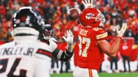 Kansas City Chiefs tight end Travis Kelce (87) fails to haul in a pass that Houston Texans linebacker Azeez Al-Shaair (0) would intercept during the fourth quarter at GEHA Field at Arrowhead Stadium.