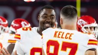 Kansas City Chiefs defensive tackle Chris Jones (95) with tight end Travis Kelce (87) against the Arizona Cardinals during a preseason NFL game at State Farm Stadium.