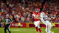 Kansas City Chiefs quarterback Chris Oladokun (19) throws a pass as Denver Broncos linebacker Jonah Elliss (52) pressures during the second quarter at GEHA Field at Arrowhead Stadium. Mandatory Credit: Denny Medley-Imagn Images