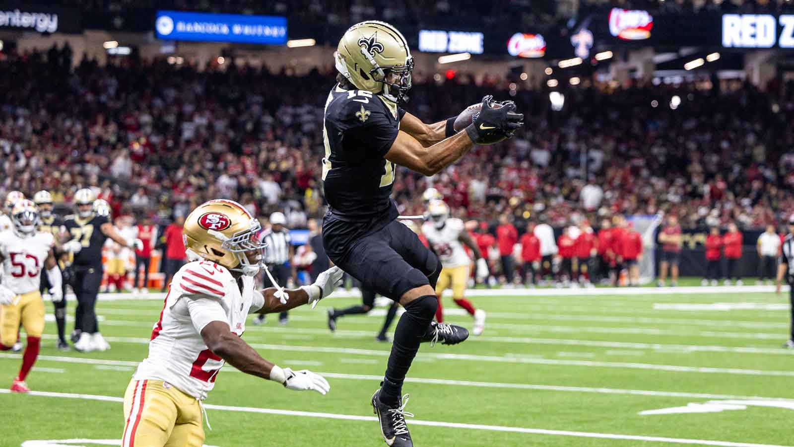 New Orleans Saints wide receiver Chris Olave (12) catches a pass against San Francisco 49ers cornerback Upton Stout (20) during the second half at Caesars Superdome.