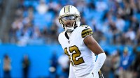 New Orleans Saints wide receiver Chris Olave (12) looks on during the fourth quarter against the Carolina Panthers at Bank of America Stadium.