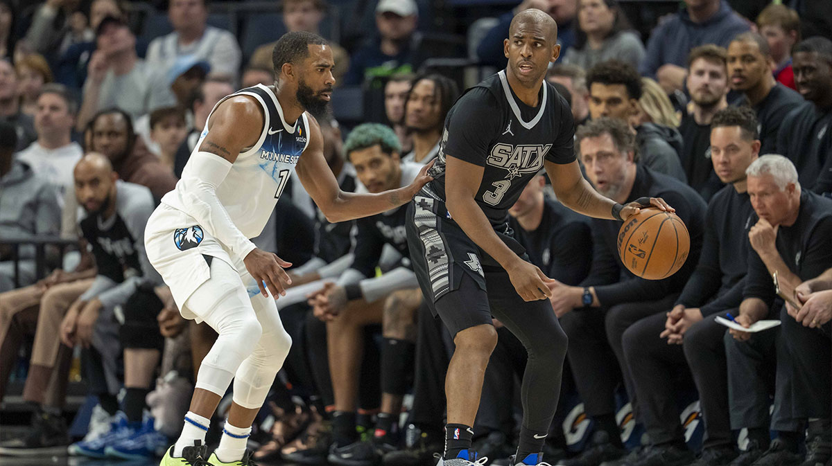San Antonio Spurs guard Chris Paul (3) dribbles the ball as Minnesota Timberwolves guard Mike Conley (10) plays defense in the second half at Target Center. 