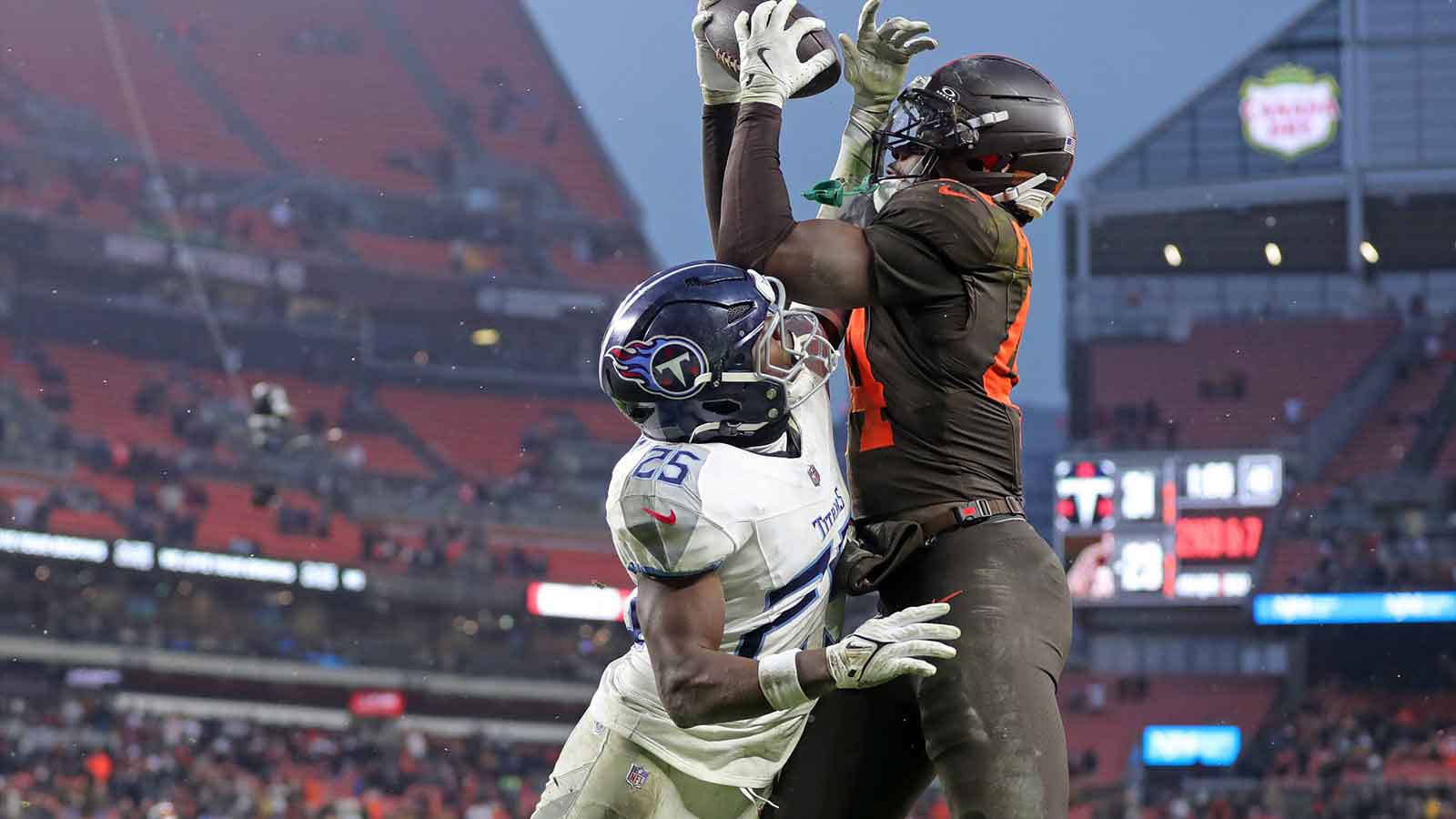 Cleveland Browns tight end Harold Fannin Jr. (44) catches a touchdown pass over Tennessee Titans free safety Xavier Woods (25)
