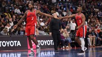 Clippers forward Kawhi Leonard (2) high-fives guard Chris Paul (3) during the second half against the Memphis Grizzlies at Intuit Dome