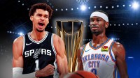Spurs' Victor Wembanyama next to Shai Gilgeous-Alexander with NBA Cup