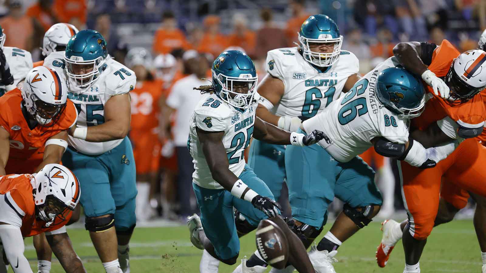 Coastal Carolina Chanticleers running back Breyahn Townsend (25) attempts to recover a fumble against the Virginia Cavaliers during the second half at Scott Stadium.
