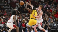 Mar 10, 2025; Chicago, Illinois, USA; Indiana Pacers forward Jarace Walker (5) chases a loose ball against Chicago Bulls guard Coby White (0) and guard Kevin Huerter (13) during the second half at United Center. Mandatory Credit: Matt Marton-Imagn Images
