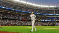 New York Yankees outfielder Cody Bellinger (35) runs in after the top of third inning against the Boston Red Sox during game one of the Wildcard round for the 2025 MLB playoffs at Yankee Stadium.