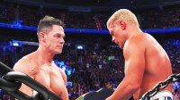 WWE stars John Cena and Cody Rhodes in a wrestling ring.